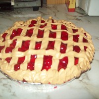 Traditional Looking Cherry Pie Cake Cherry cake with real Cherries on top, Buttercream frosting and a cherry flavored crumb coat Let me know what you think!