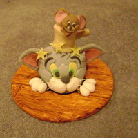 Tom And Jerry This was a madeira cake - Tom and the hammer are fondant covered cake, and Jerry is completely made of Fondant. The board is covered in...