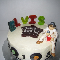 Elvis Elvis & records were made out of gumpaste; Letters and star was made out of melted Jolly Ranchers. The music notes were made out of...