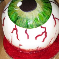 Severed Eyeball Very proud of my first eyeball cake. The cake had colored layers with a strawberry filling covered with a vanilla fondant.