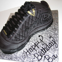 Shoe - Nike L2 The Nike sneaker was made with white cake, strawberry filling and covered with vanilla buttercream and vanilla flavored fondant.