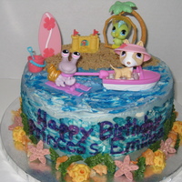 Littlest Pet Shop This cake was made of white cake with fresh raspberries & glaze filling and raspberry buttercream. The sand was brown sugar and the...