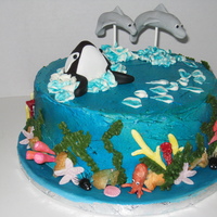 Whale & Dolphins Red Velvet cake with cream cheese filling and icing. The ocean details were made with gumpaste and choco-pan.