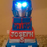 Transformer Cake With Led Lights For Eyes This cake was alot of fun, I was so happy with end result and loved it even more when i put the lights in the eyes.worth the time i put in...