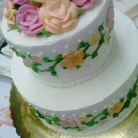 Pretty In Peach Wedding cake with peach and pink roses. Done in buttercream.