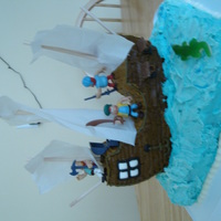 Pirate Ship Cake This cake was so much fun to make...a real learning experience. The "water" is a chocolate sheet cake, while the "pirate...
