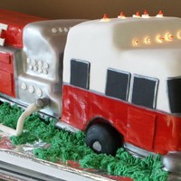 Fire Truck To The Resue Hand sculpted pound cake with rolled fondant and buttercream, hand painted with edible colors. Conner's 4th birthday.