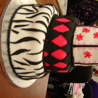 Whimsical Cake First whimsical cake. Fondant cover irish cream, champagne and cinnamon layered tiers.