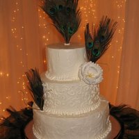 Peacock Cake Italian meringue butter cream with a rough finish, sugar paste peony flower.
