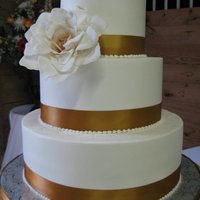 Fantasy Flower 3 tier buttercream cake with satin ribbon and handmade fantasy flower in gumpaste