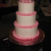 Pink Ribbon buttercream 3 tier cake with pink details and sugar paste bow