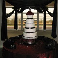 Bling Cake 5 tier buttercream cake with satin and rhinestone ribbons, broach, and fresh flower topper.