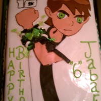 Ben 10 Cake 1/2 sheet cake with fondant accents. Watch also made with fondant and sprinkled with disco dust