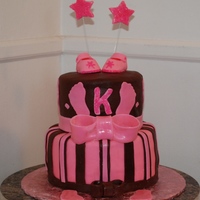 Pink And Brown Feet 9IN AND 6IN CAKES COVERED AND DECOORATED IN MMF. STARS AND SHOES ARE MADE OF GUMPASTE AND SUGAR GLITTER.