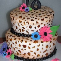 Leopard Print And Daisies 6" and 8" rounds covered in white fondant. hand painted leopard print. GP daisies, leaves and '18' topper.