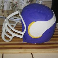 Minnesota Vikings Helmet Two round cakes and one baked in a pyrex bowl. Fondant, the facemask is from a real helmet