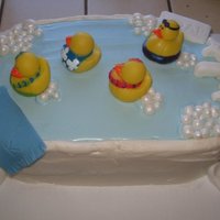 Duckies In A Bathtub Buttercream frosting with fondant accents and really rubber duckies