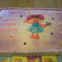 Abby Kadabra This is a new character from Sesame Street. She is made from an edible image. Royal icing flowers.