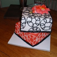 Bridal Shower Chocolate 3 layer on White 3 layer, bottom layer with white buttercream center, melon colored buttercream exterior, top is melon colored...