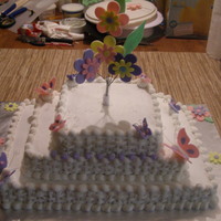 Simple Baby Shower 3 tiered sheet cakes, covered in buttercream, handmade fondant butterflies and flowers. :)