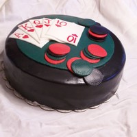 Poker Cake Devil's Chocolate cake, filled with chocolate mousse, frosted with Irish Cream flavored buttercream. Covered in fondant with fondant...