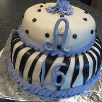 Sweet 16 Zebra Cake Devil's chocolate cake, chocolate mousse filling with vanilla buttercream. Covered in fondant with fondant stripes and dots. Accents...