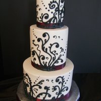 Nicole's Wedding Cake Buttercream-covered 4", 6" extra tall, and 9" tiers with royal icing piping