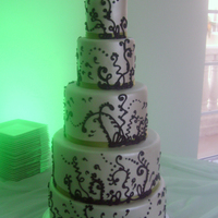Funky Five Tier Wedding Cake Pearlized marshmallow fondant over dark chocolate cake with black royal icing