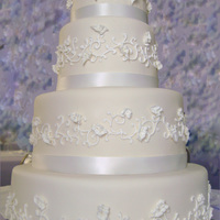 Wedding At Tiffany's 4-6-9-12 inch tiers, WASC (white almond sour cream) cake, marshmallow fondant and royal icing vines and ruffled leaves