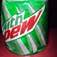 Mountain Dew Can Stacked round cakes covered with buttercream icing and fondant accents. Cakes were actually a lemon lime /mtn dew flavor, but it was too...