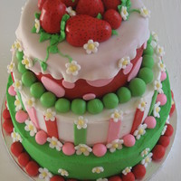 Strawberry Short Cake Top - yellow cake with strawberry filling, Middle - vanilla with strawberry filling, bottom - Chocolate, with cheesecake mouse.Iced in...