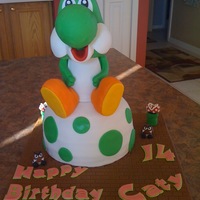 Yoshi Cake Yoshi is make of RKT covered in fondant and egg is yellow cake covered in fondant.