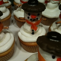 Snowman Cupcakes These are regular cupcakes with bc icing. The snowman is made out of marshmellows, pretzel sticks, thin mints, junior mints, and fruit roll...