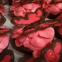 Butterfly Cupcakes I made the butterflies out of chocolate and piped the flower petals with buttercream. I thought they were really pretty.