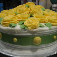 Yellow Roses With Green Ribbon 8" round cake with butter cream roses.