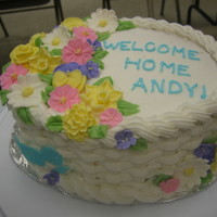 Wilton Level 2 Final Cake Basketweave around the side. Royal Icing flowers with color flow bird