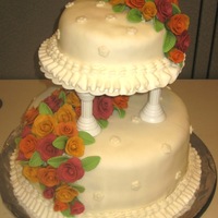 My First Tiered Cake 4" High Cakes - 6" and 10" round, covered in fondant. I orginally put cream cheese filling in the top cake but had to take...