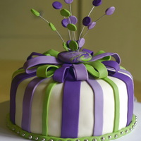 Purple And Green Cake The colours didn't work in the picture - this is dark purple, light purple and lime green. Learned that fondant bows need to dry...