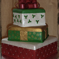 Presents For The Family My cake for our big Christmast family gathering. 10" dummy tier, then the 8" is chocolate with french vanilla frosting w crushed...