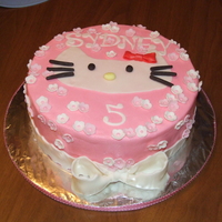 Hello Kitty Cake 9in strawberry cake covered with white chocolate buttercream and fondant accents. TFL!