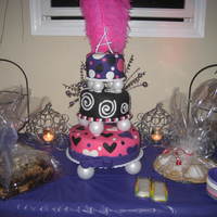 Sweet 16 Neon Birthday Cake Three tier cake with neon fondant. Shaped fondant cutouts in contrasting colors made the cake pop! And the feather was the perfect topper...