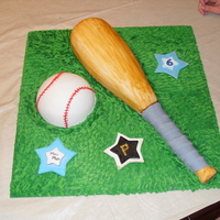 Baseball And Bat Birthday Cake Birthday Cake for a 6 year old boy. Fondant stars for a personal touch.