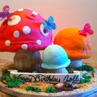 Mushroom Cake strawberry cake sitting on top of rice crispy stems rocks are jellybeans