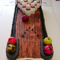 Bowling For Birthdays This is yellow cake with RKT bowling pins covered in white chocolate and jawbreakers for bowling balls for twins Paige and Nick