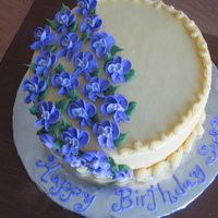 Violet Birthday This is an 8" vanilla cake with a whipped cream strawberry filling. The flowers are supposed to be purple but the camera color came...