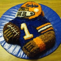 Gator Footballplayer I made this Gator football player for my boss' birthday. It is a white sour cream cake with vanilla buttercream. He is a big Gator fan...