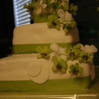 60Th Birthday Cake 3 tiers of white cake with strawberry butter cream filling. Fresh orchids. This was my first square cake. I am still working on my lines...