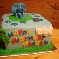 Blues Clues Inspired Cake Fondant Blue the dog, paw prints, house, happy birthday & apples on trees. Buttercream icing with buttercream trees, grass & clouds...