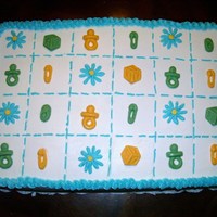 Baby Blanket Cake This is two half sheets stacked with strawberry filling and a baby blanket motif with molded baby blocks, shoes, pacifiers, diaper pins and...