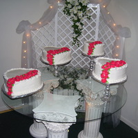 Heart Layers With Cascading Butter Cream Roses The roses are buttercream painted with gold pearl dust.